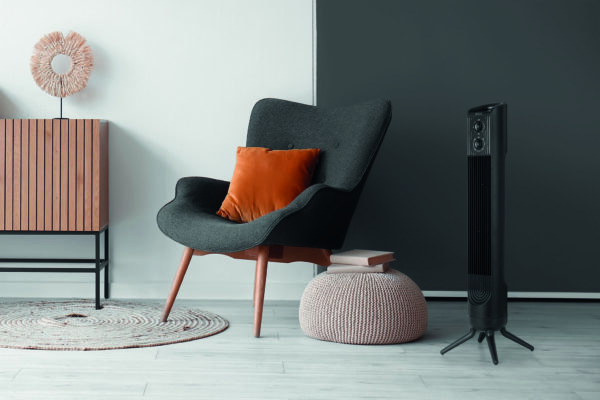 Interior of stylish living room with wooden cabinet and cozy armchair