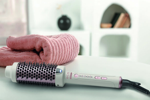 Pink towel on white board in home interior and empty space for your decoration.